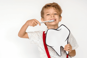 A child brushing their teeth